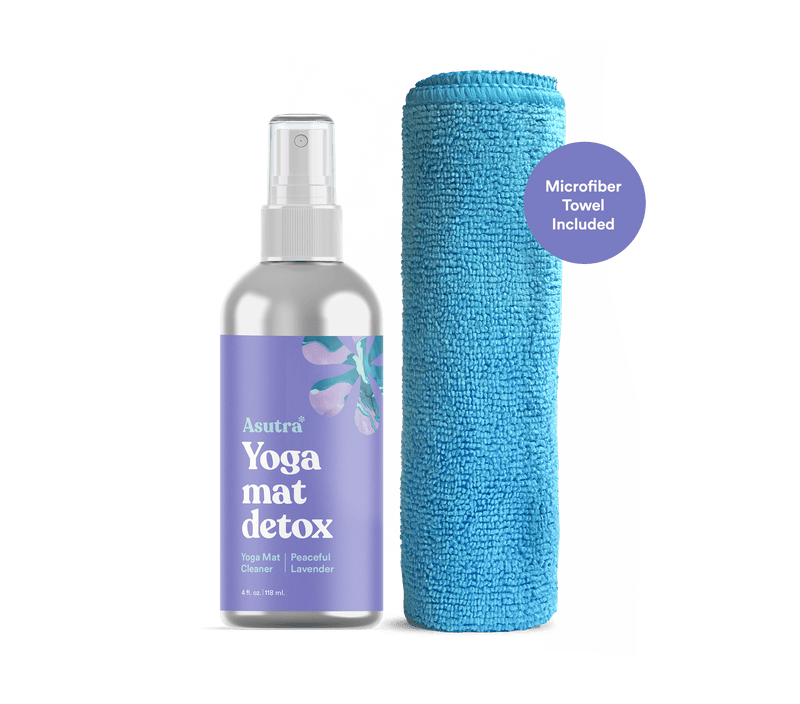 Aluminum lavender yoga mat cleaner spray bottle with microfiber towel, labeled "Asutra Yoga Mat Detox," featuring lavender scent.