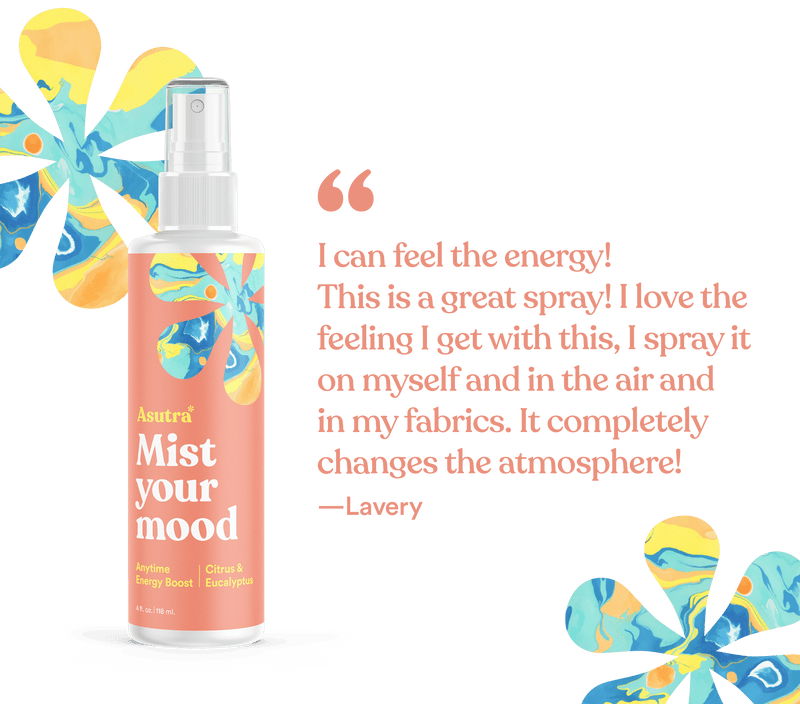 Aromatherapy mist spray bottle labeled "Mist your mood" with colorful abstract floral design, promoting energy and mood boost.