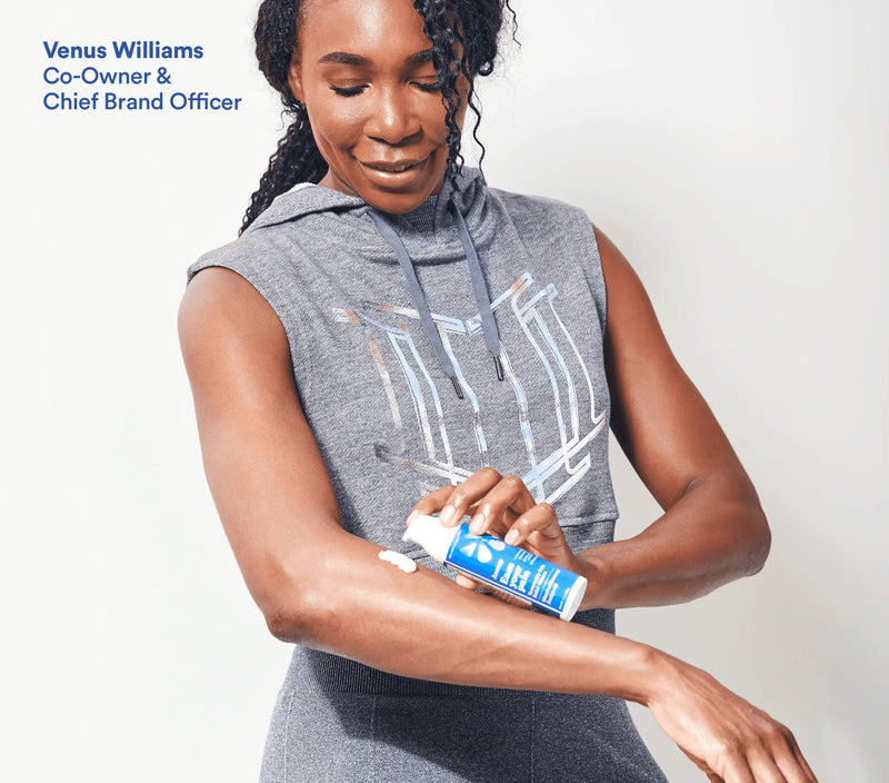 Woman applying Menthol & Arnica Pain Relief Gel to her arm, demonstrating its use for soothing muscle pain.