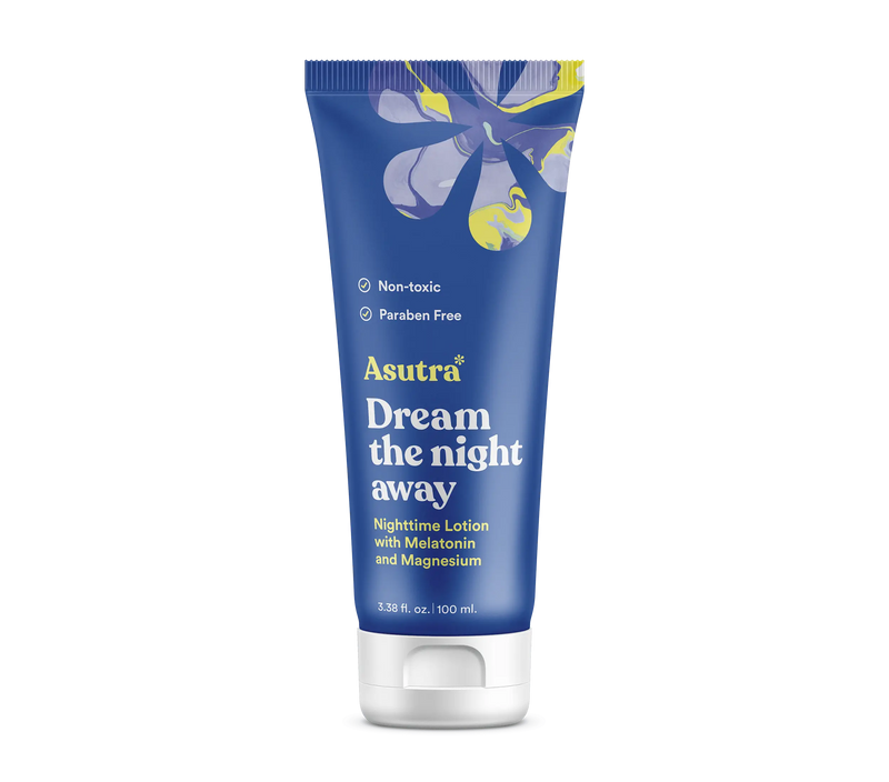 Blue tube of Asutra Dream the Night Away lotion with melatonin and magnesium, labeled non-toxic and paraben-free, for better sleep.