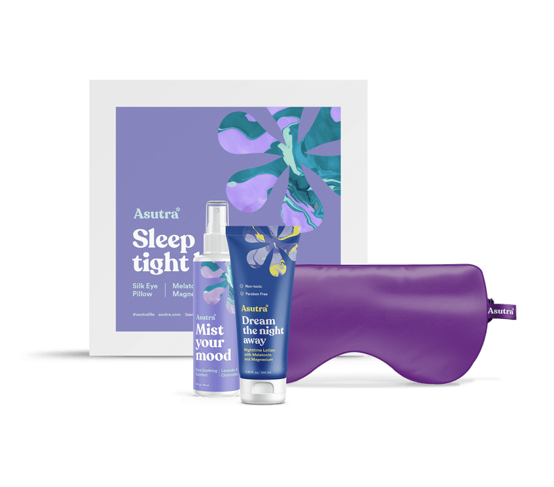 A sleep kit including a purple eye mask, a mist spray bottle, a lotion tube, and a box labeled "Sleep Tight" with a purple and green abstract design.