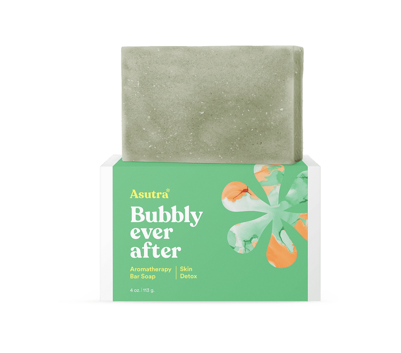 A green and white box of Asutra Bubbly Ever After Skin Detox Bar Soap with a beige soap bar on top.