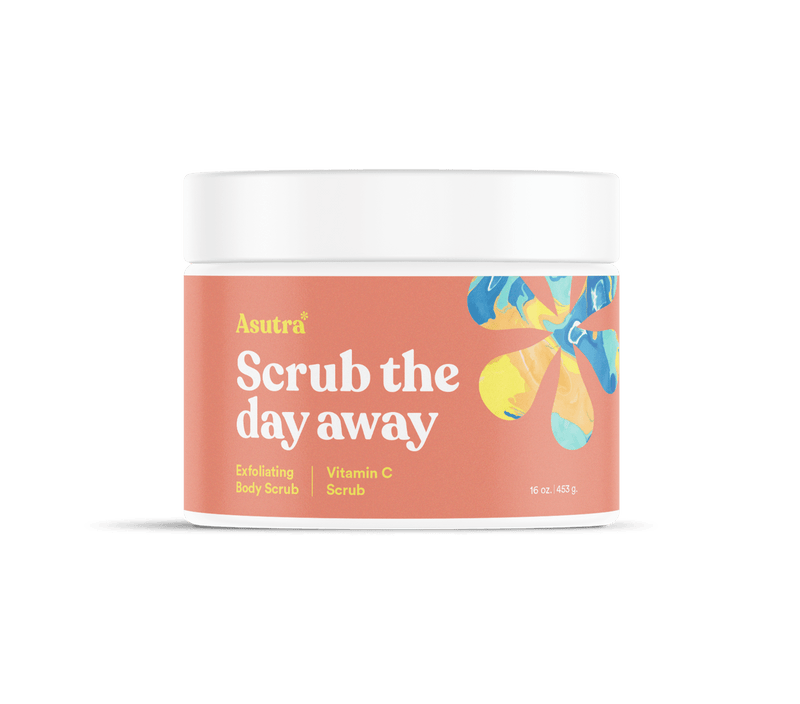 A jar of Asutra Vitamin C Body Scrub with a peach-colored label, colorful abstract flower design, and white lid.