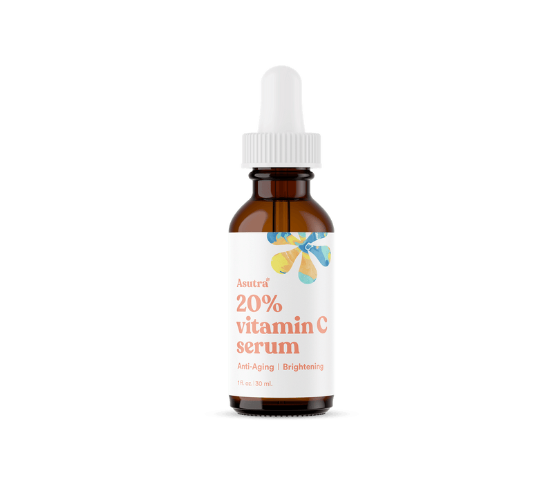 Amber glass bottle of Vitamin C anti-aging serum with a white dropper cap, labeled "20% vitamin C serum" for brightening skin.