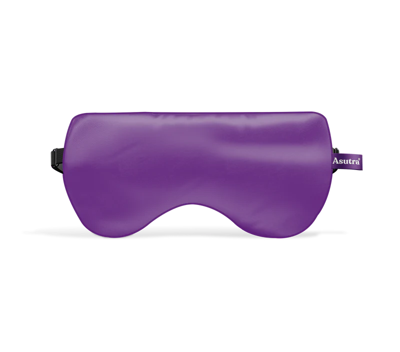 Silk purple eye pillow in a purple gift box, designed for relaxation and sleep, with a soft, smooth texture.