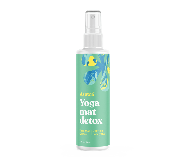 Spray bottle of Uplifting Eucalyptus Yoga Mat Cleaner with a green and blue abstract label design, promoting freshness and detox.