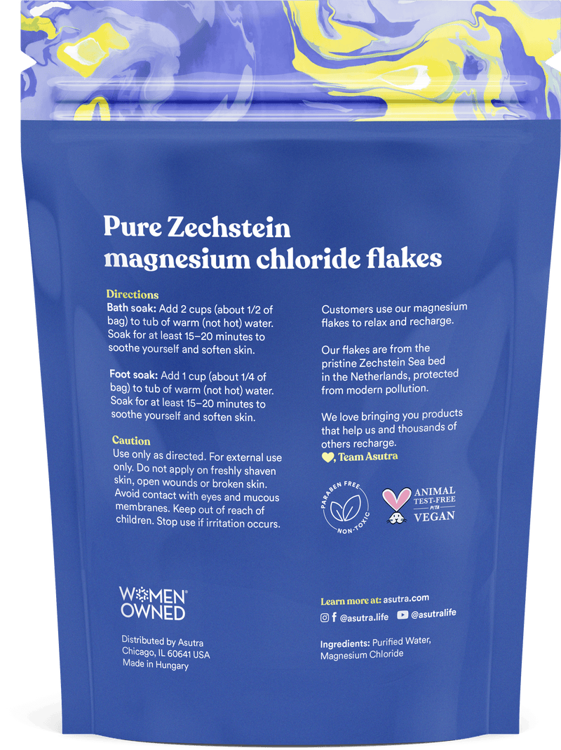 Packaging of Asutra Magnesium Chloride Bath Flakes, featuring usage directions and ingredient details for relaxation and recovery.