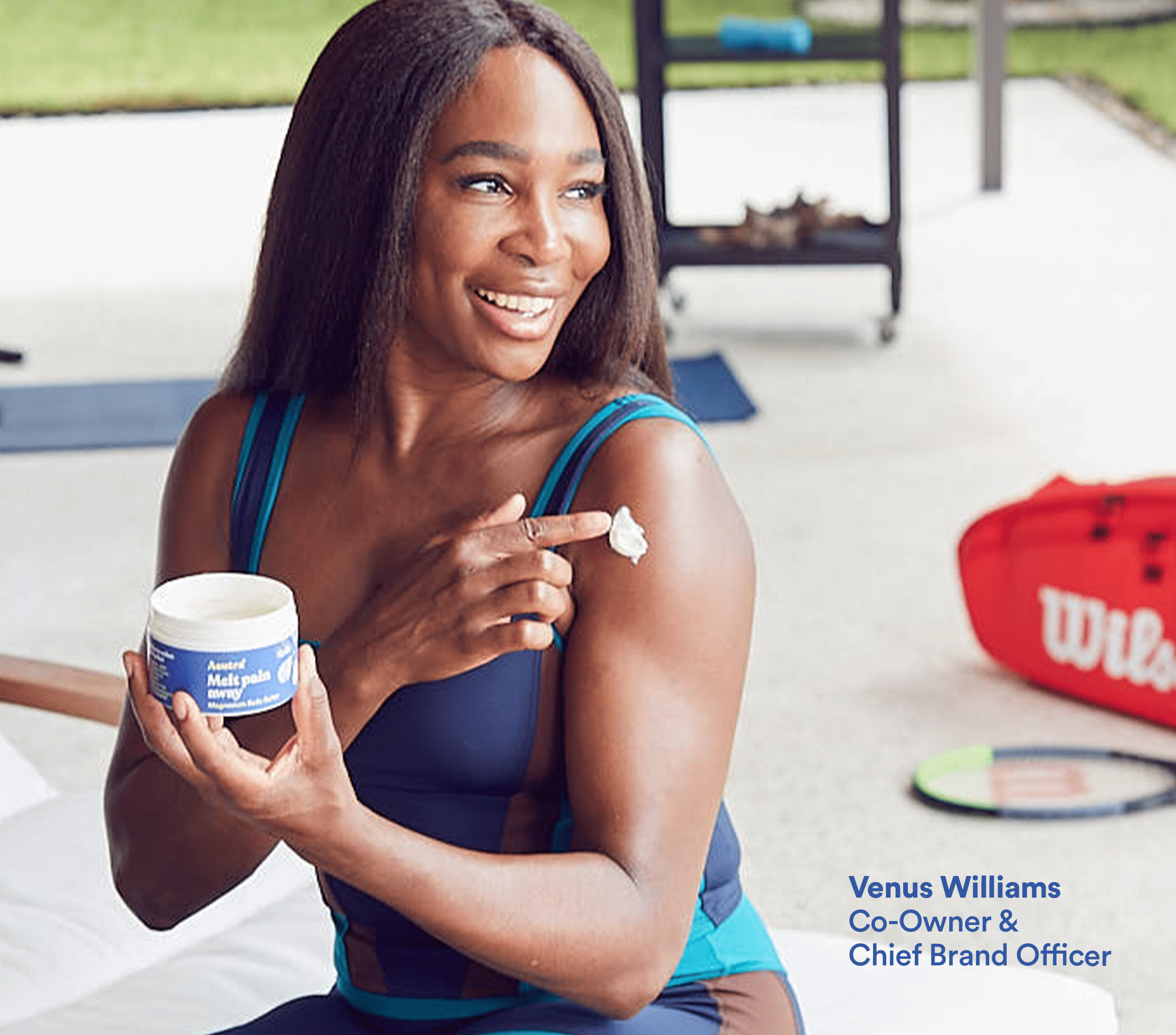 Venus Williams applying Melt Pain Away magnesium body butter lotion to her shoulder and arm. 